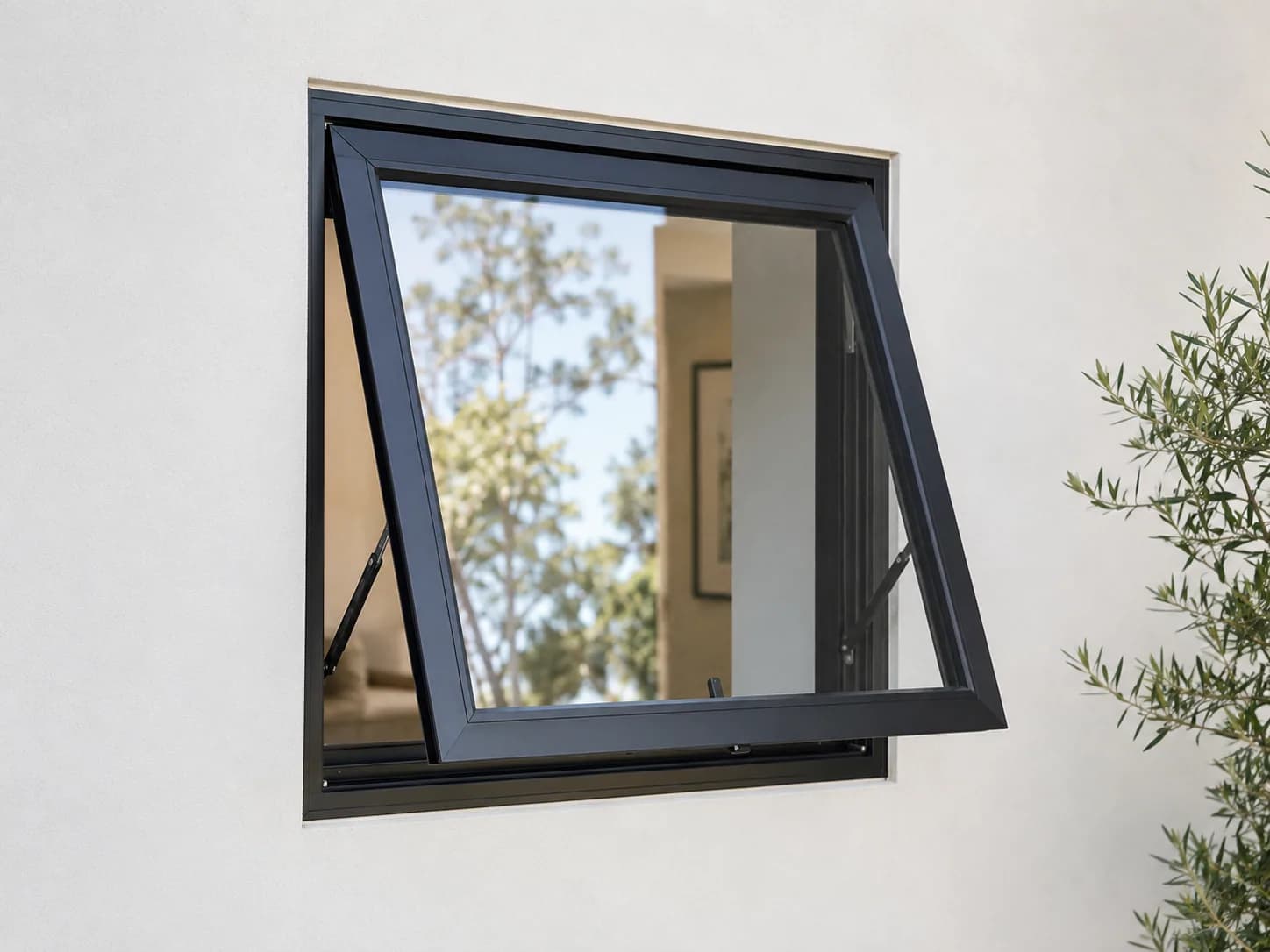 Black aluminium awning window open in a modern home